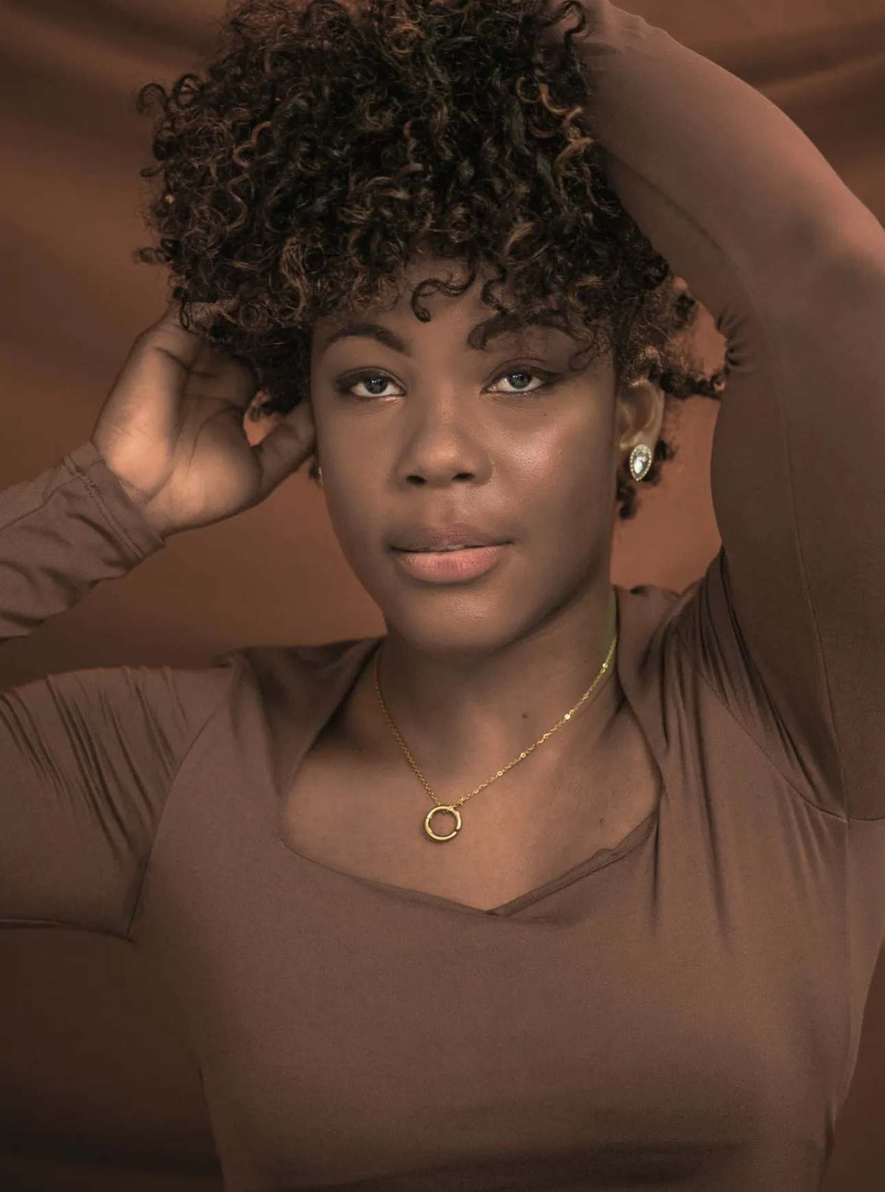 4C hair routine: woman with short, moisturized coily hair after a treatment